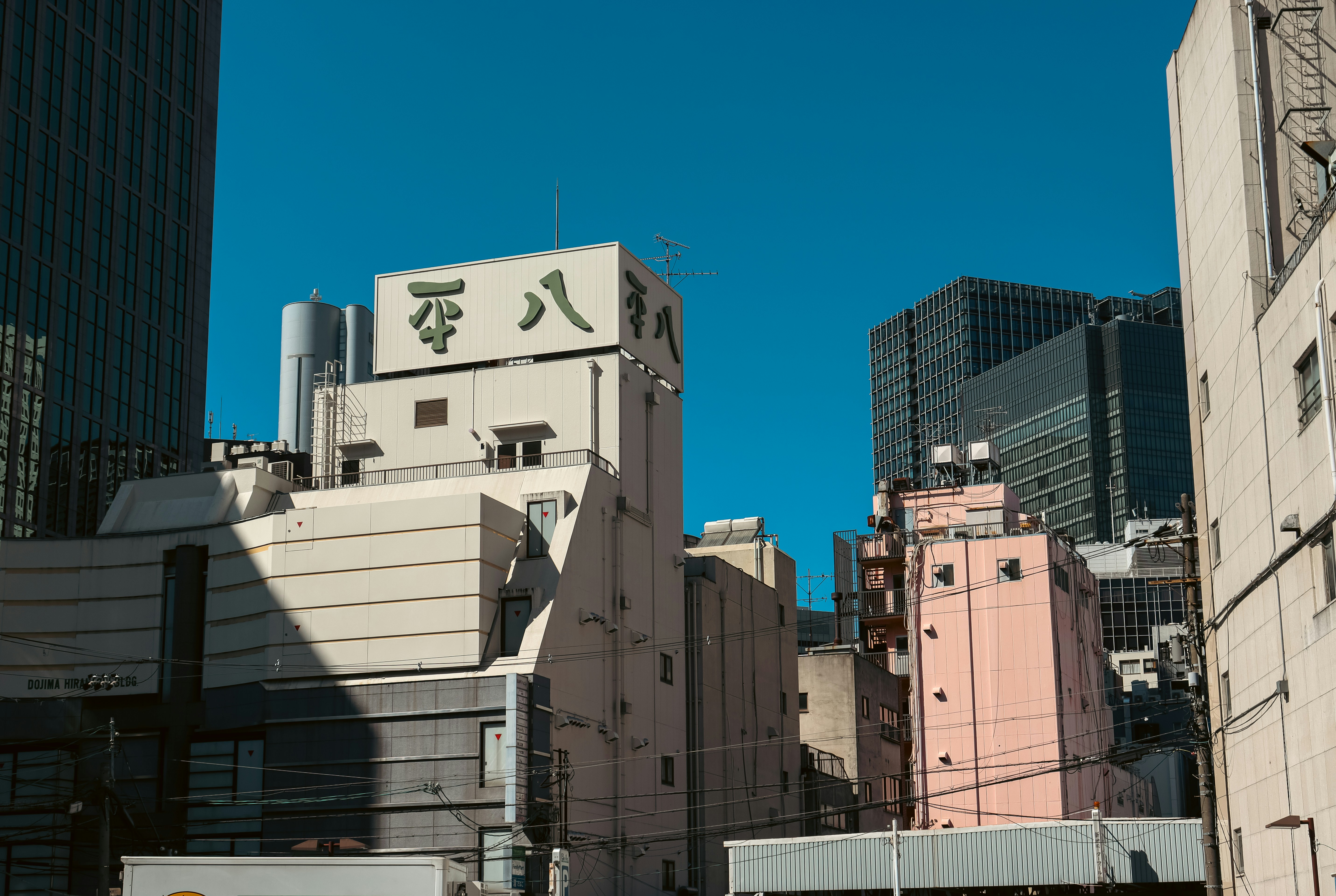 Buildings in a city under a clear blue sky