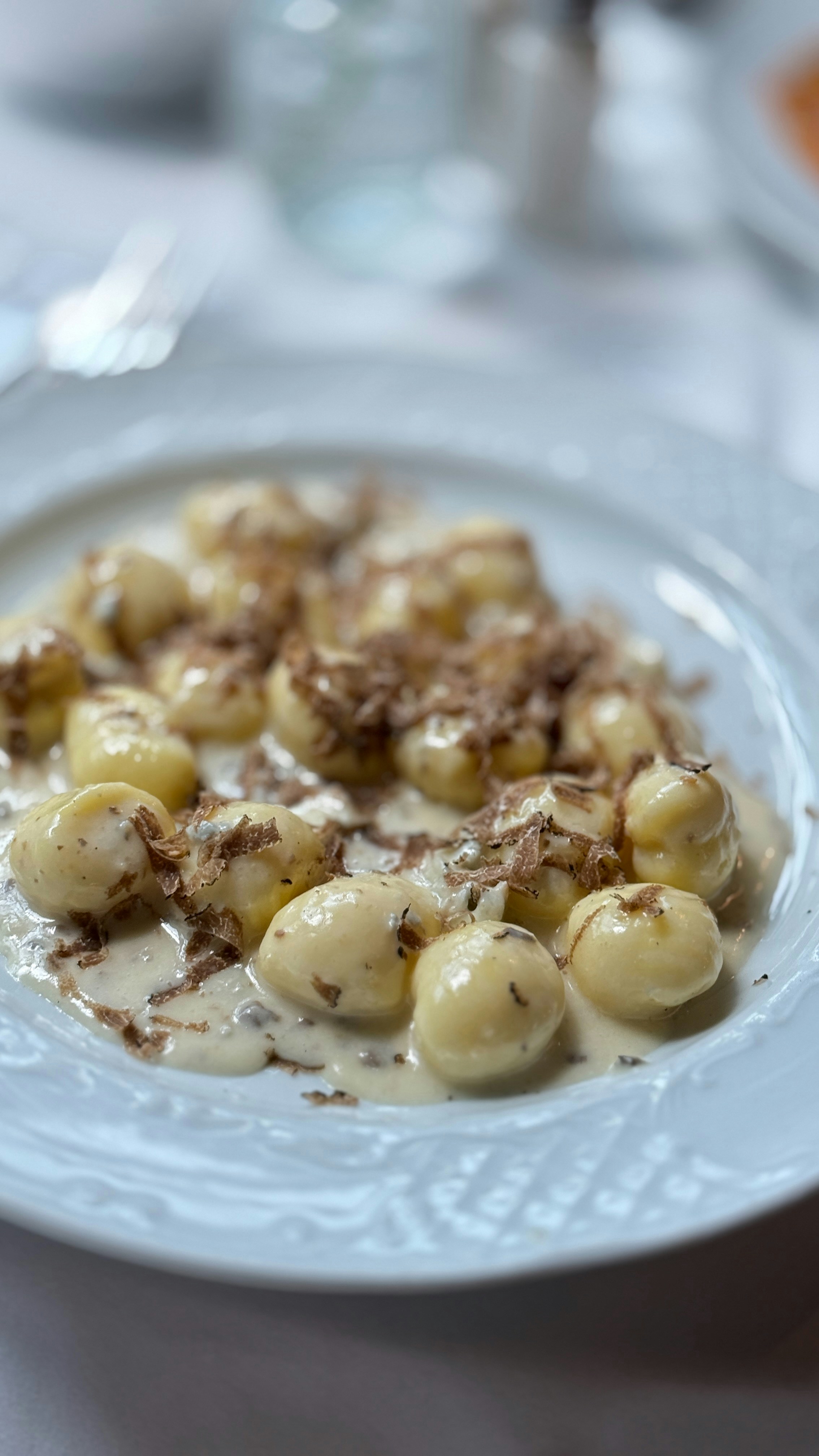 Gnocchi with creamy sauce and shaved truffles