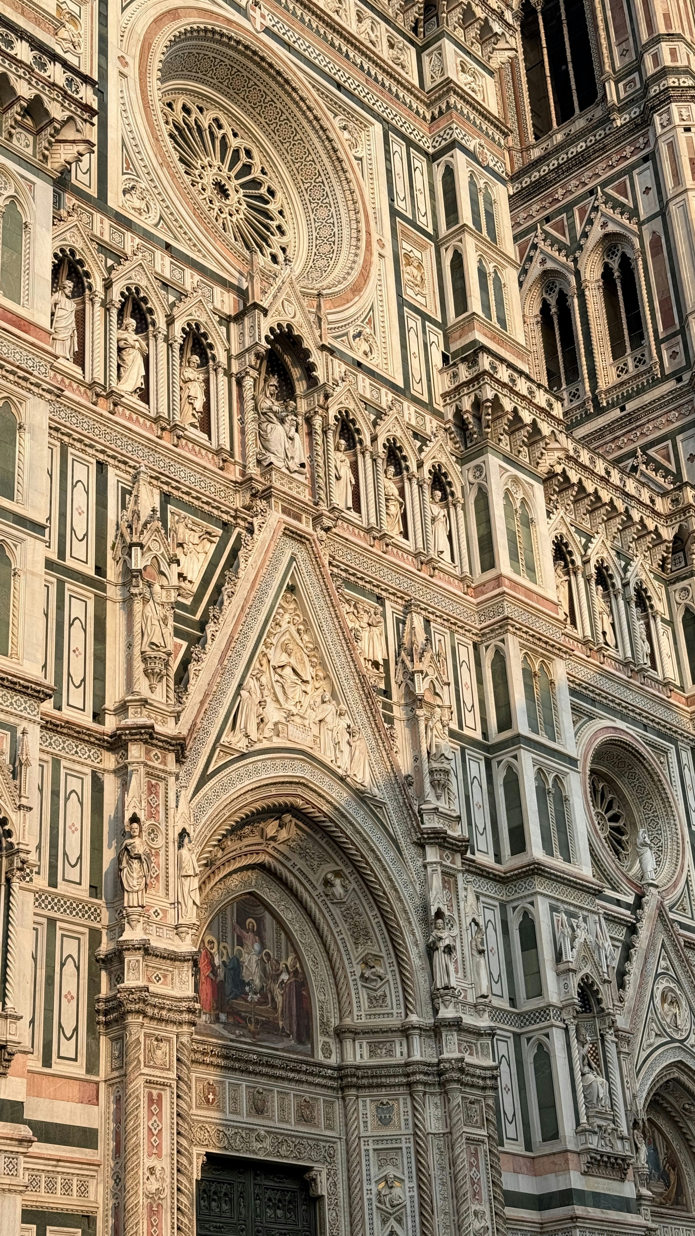 Ornate facade of a grand cathedral with intricate stonework.
