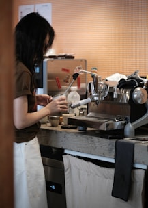 Barista preparing coffee at an espresso machine