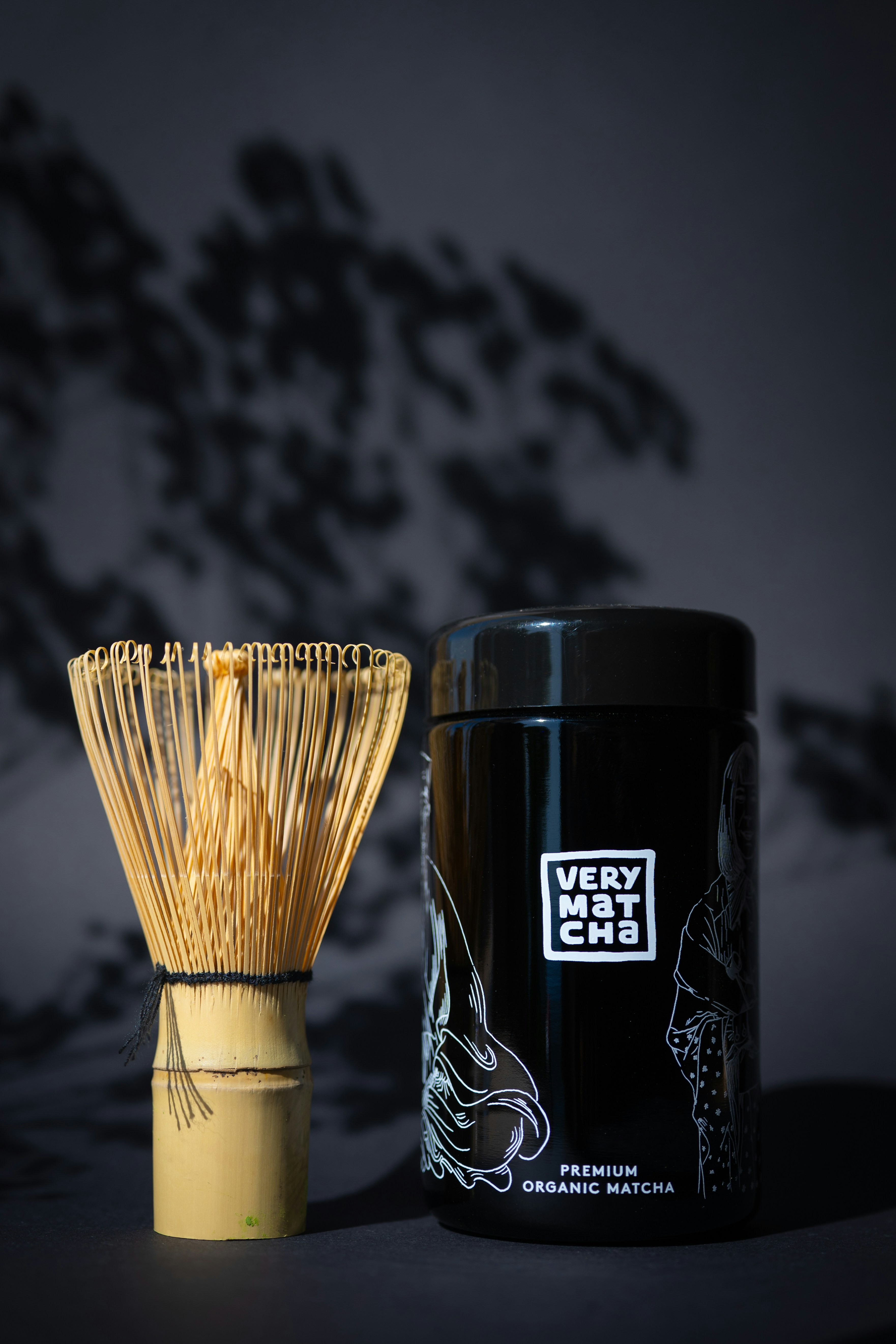 Matcha tea whisk and container with japanese art