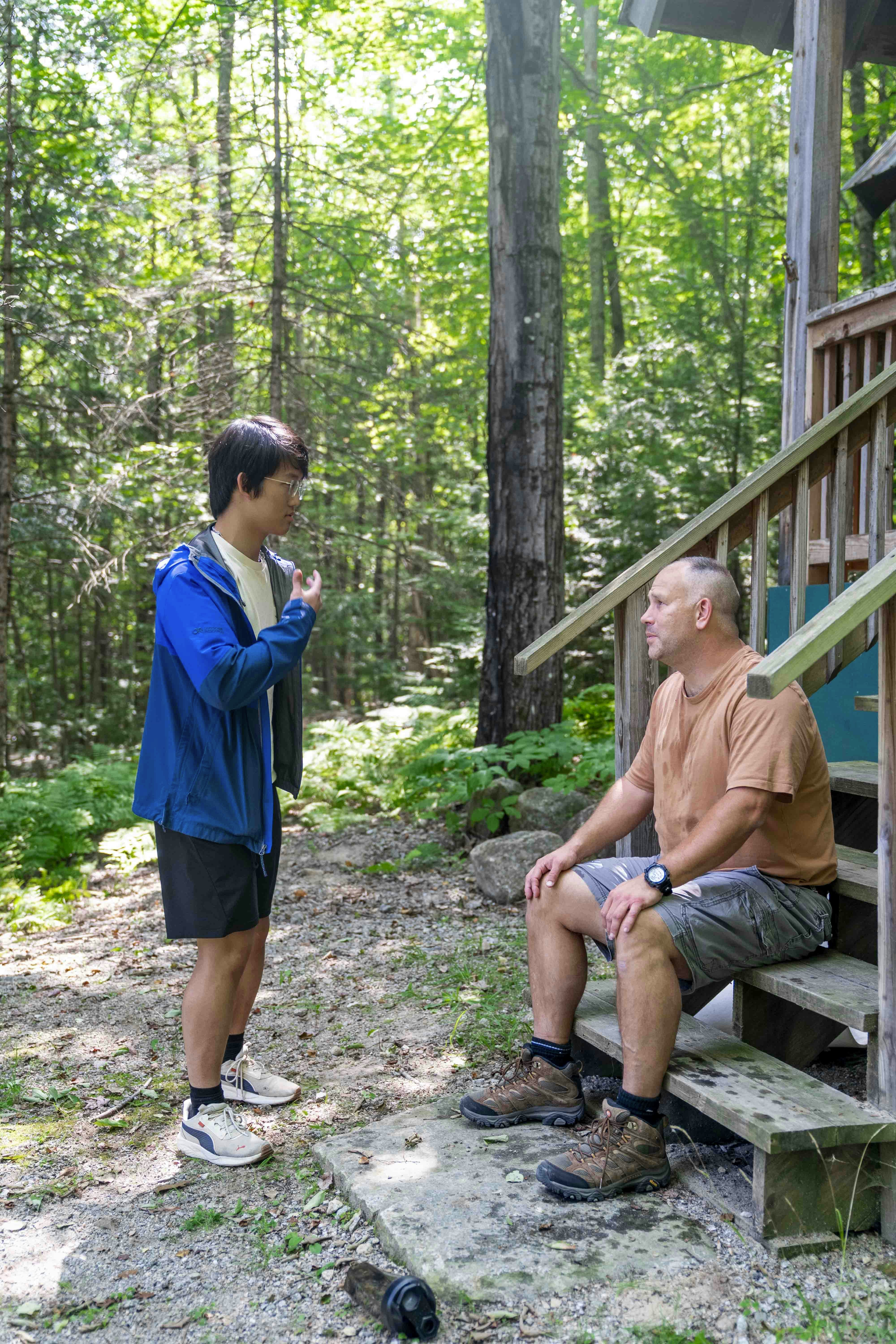 Homeowner talking to a termite control professional during a consultation