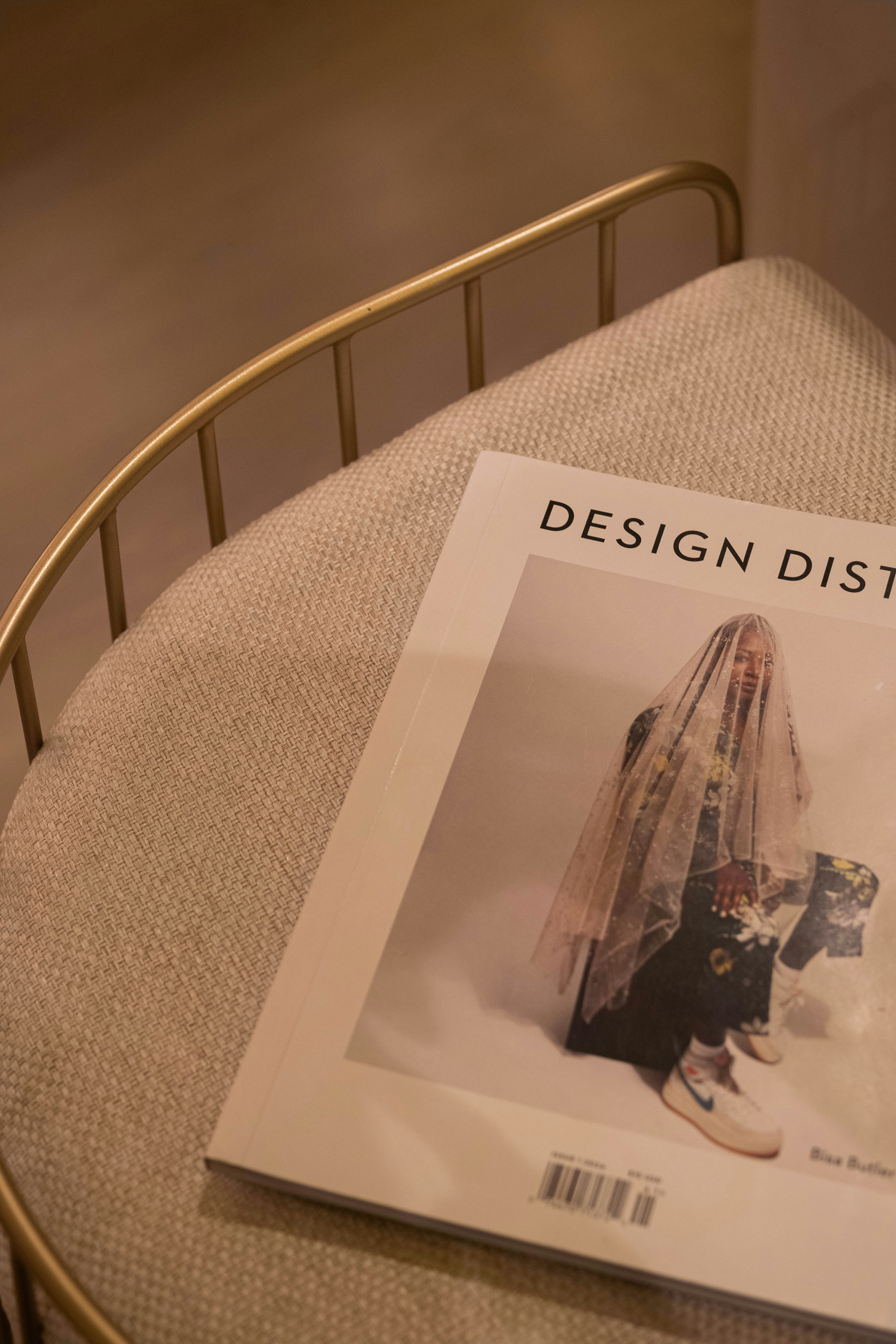 Magazine on a chair with a person on cover.