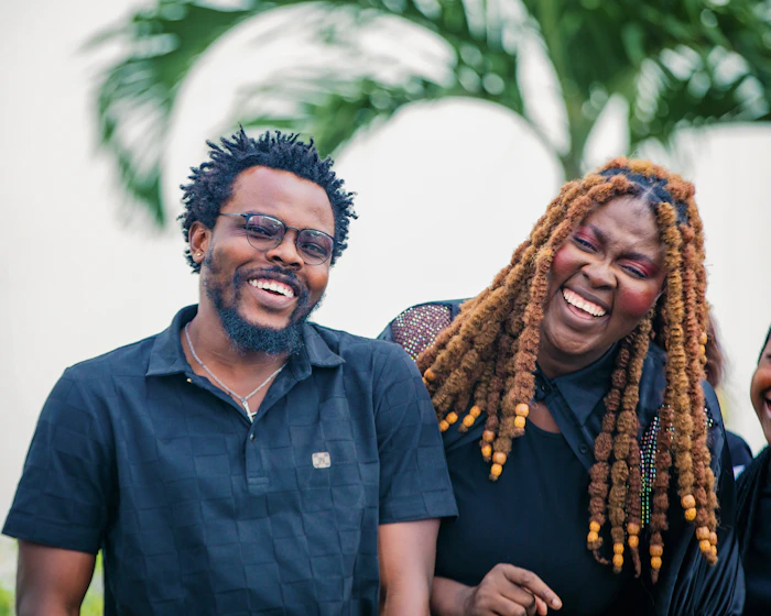 Two people laughing together outdoors