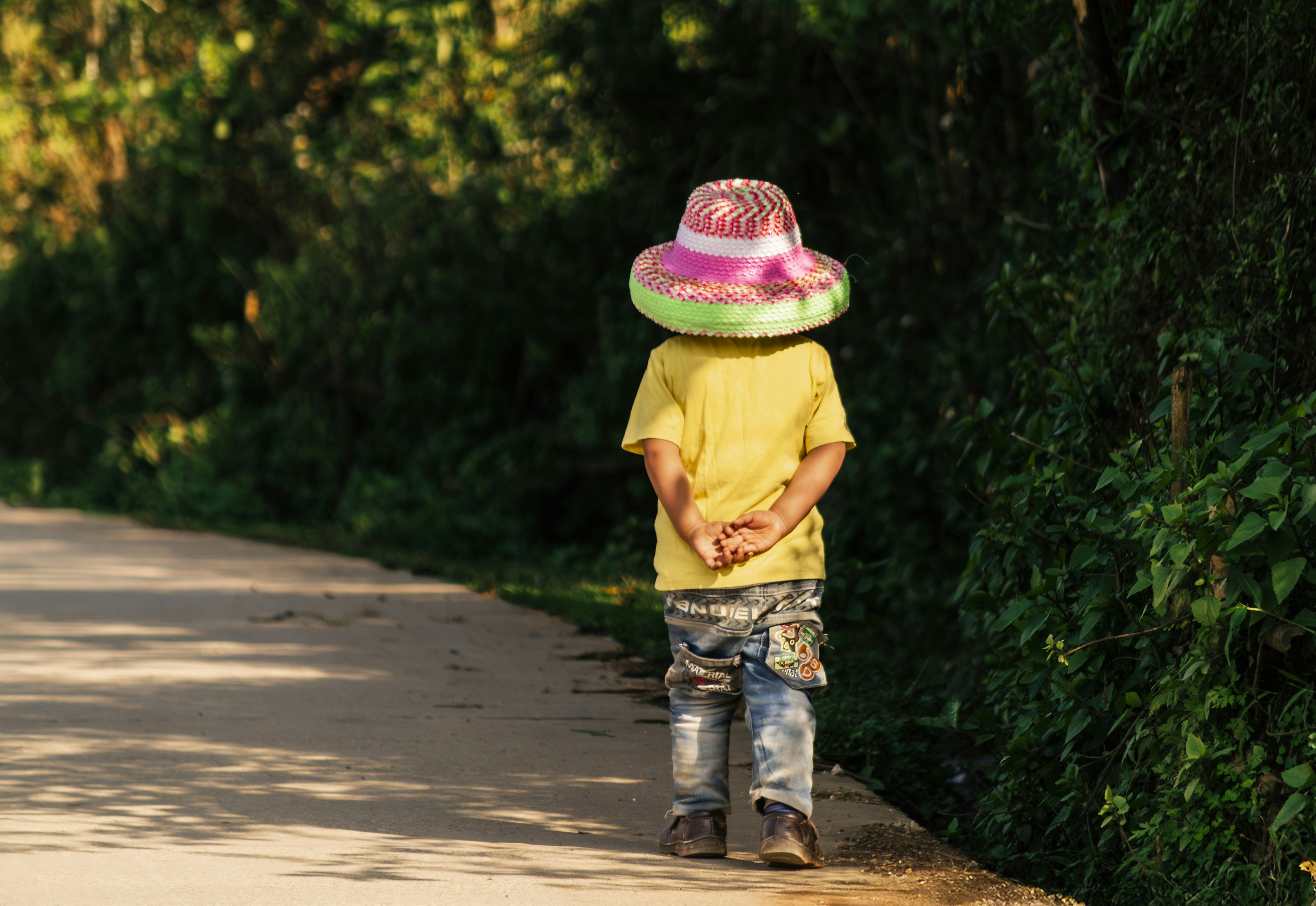 Child with Hat Walking a Rural Path in Yuanyang, China