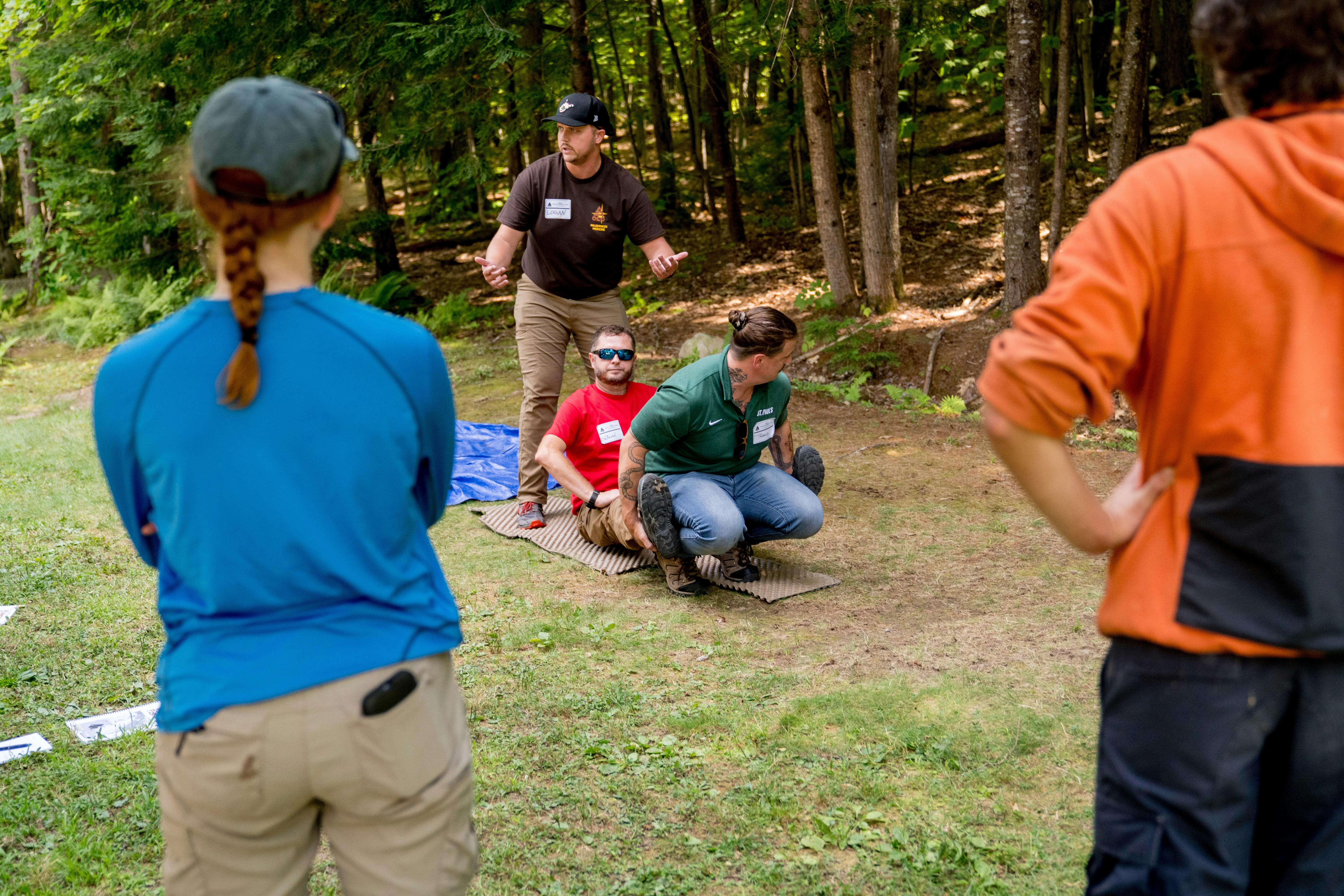 Pickleball players huddled together, strategizing during a competitive match timeout