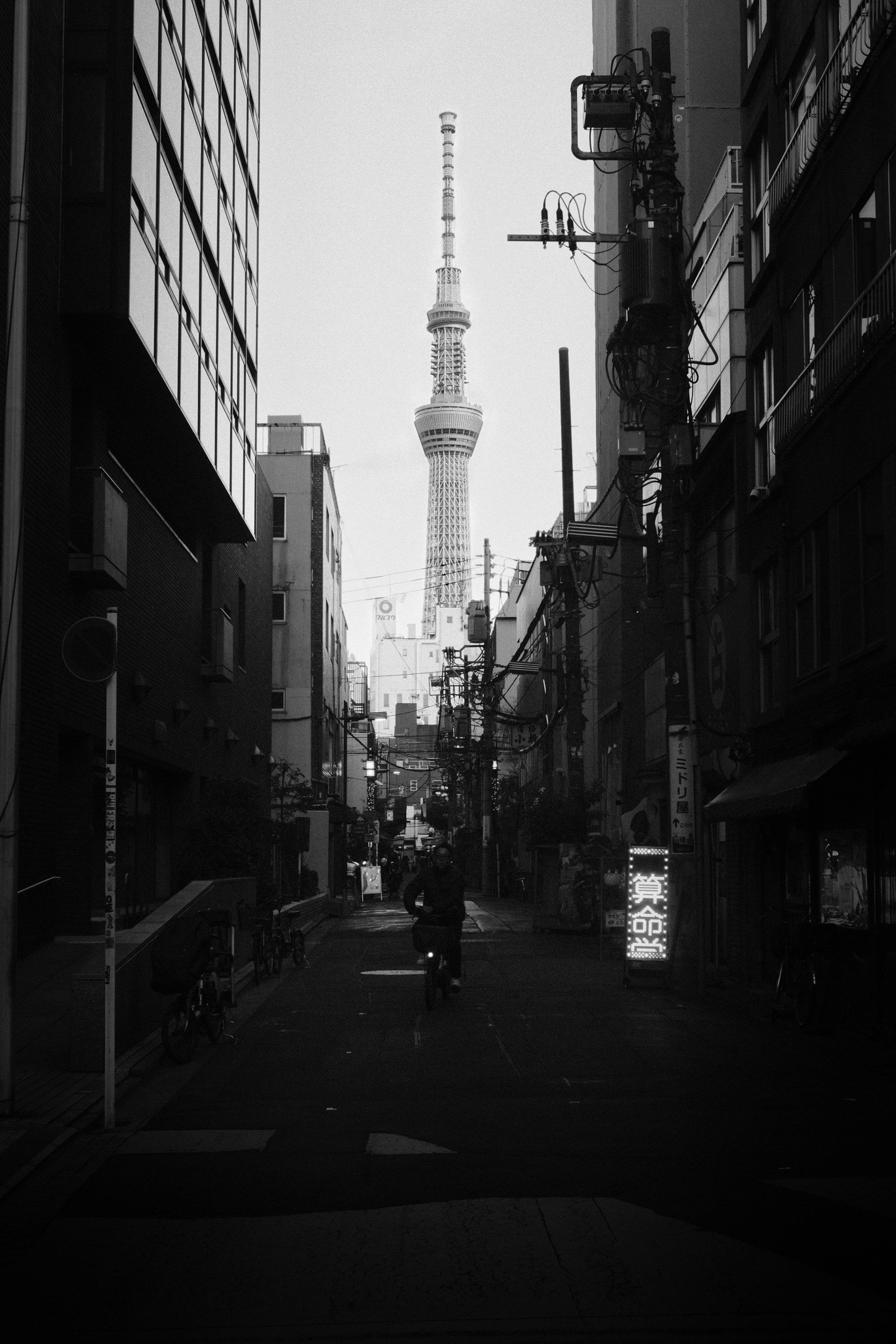 Tokyo skytree tower visible down city street
