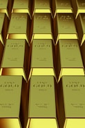 Rows of shiny gold bars stacked neatly