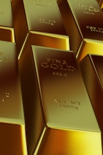 Rows of shiny gold bars stacked closely together