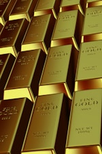 Rows of shiny gold bars stacked neatly.