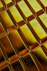 Rows of shiny gold bars stacked neatly