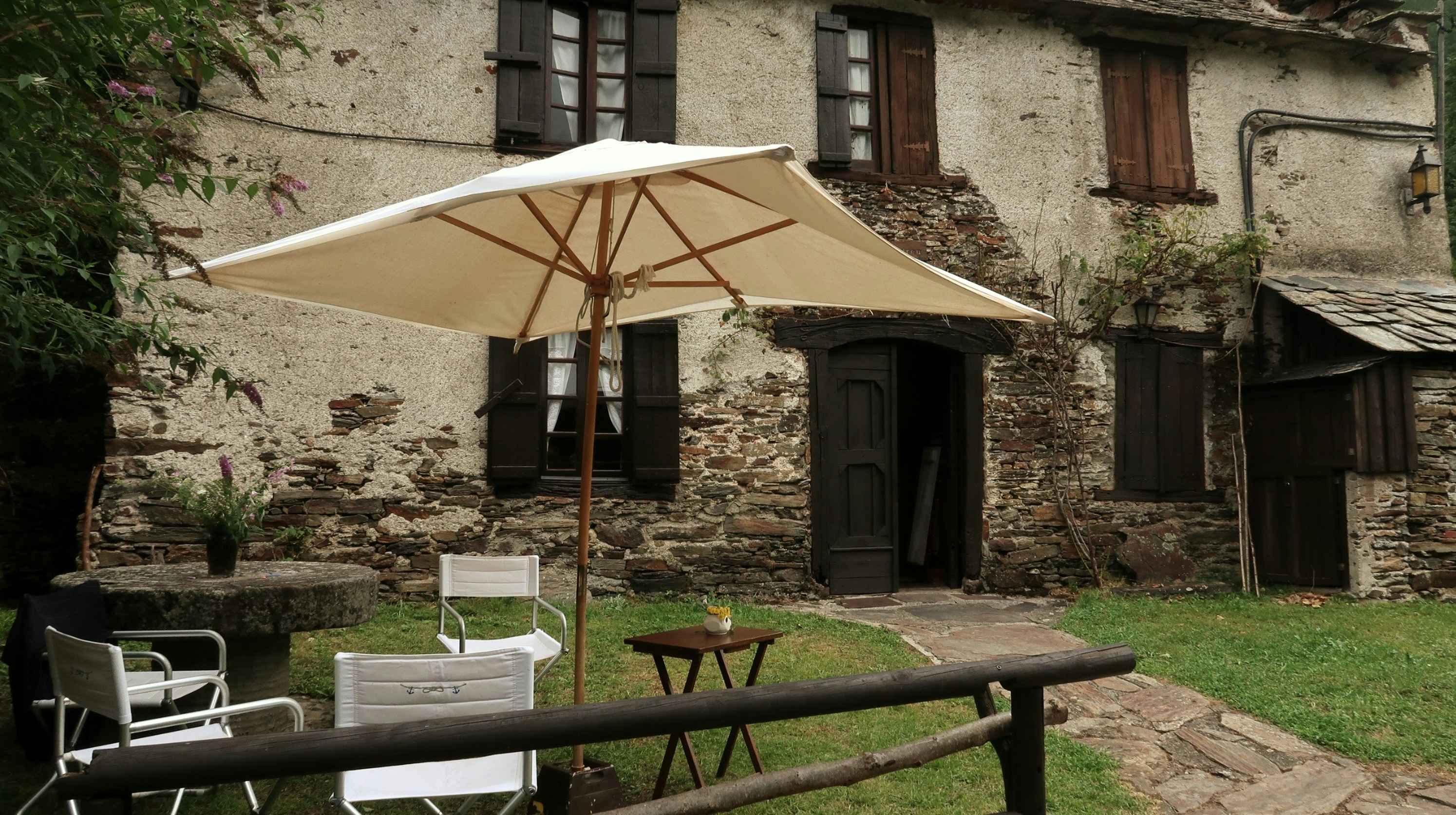 Rustic stone house with outdoor seating area
