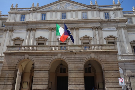 Grand theater facade with italian and eu flags