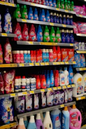 Shelves stocked with various cleaning supplies and detergents.
