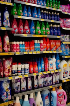 Shelves stocked with various cleaning supplies and detergents.