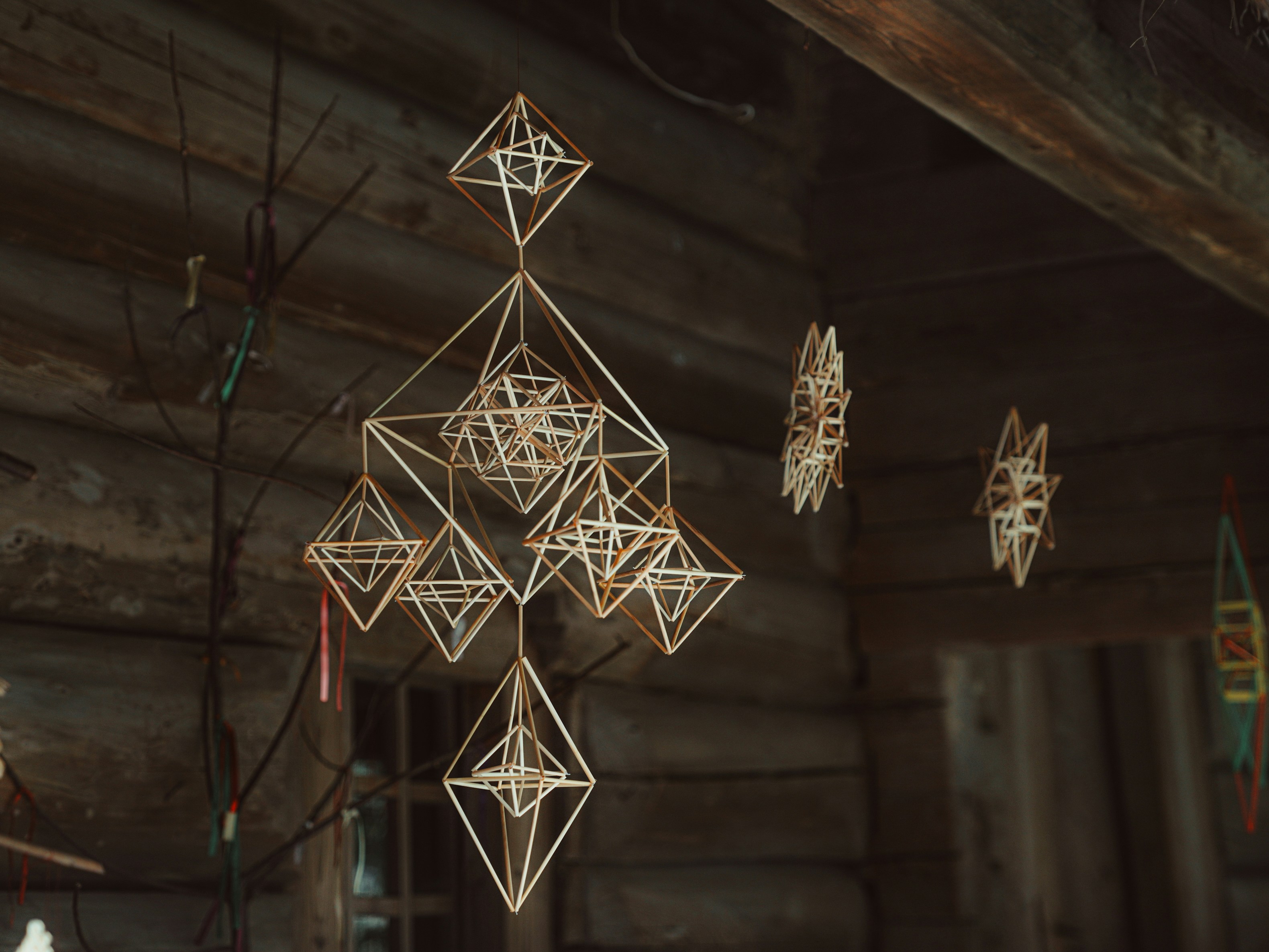 Handmade straw ornaments hanging indoors