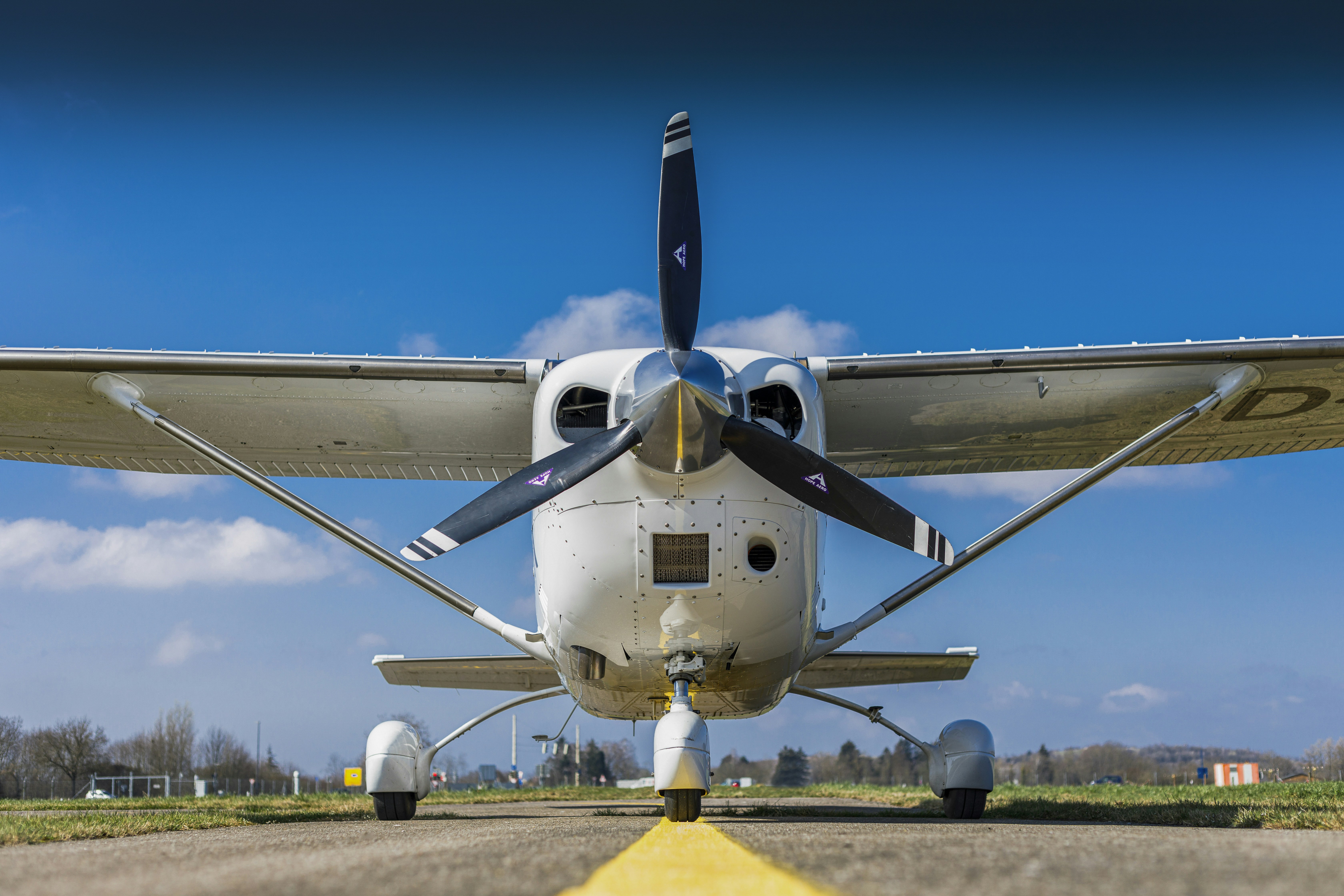 Small white airplane on a runway