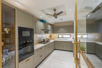 Modern u-shaped kitchen with sleek cabinetry and appliances.