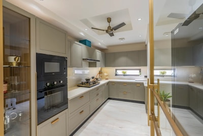 Modern u-shaped kitchen with sleek cabinetry and appliances.