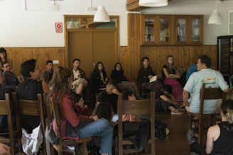 Group of people sitting in chairs listening attentively