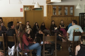 Group of people sitting in chairs listening attentively