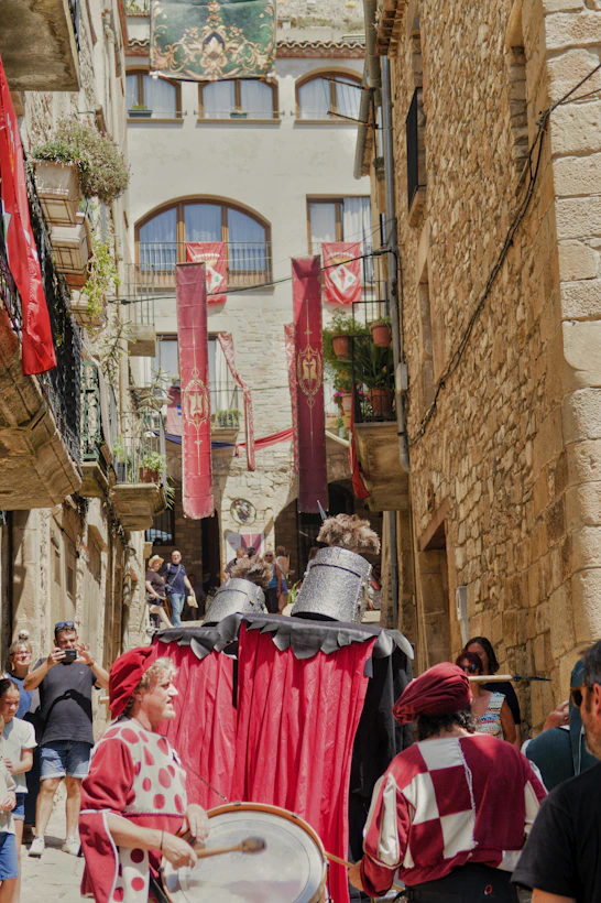 People in medieval costumes during a street festival.