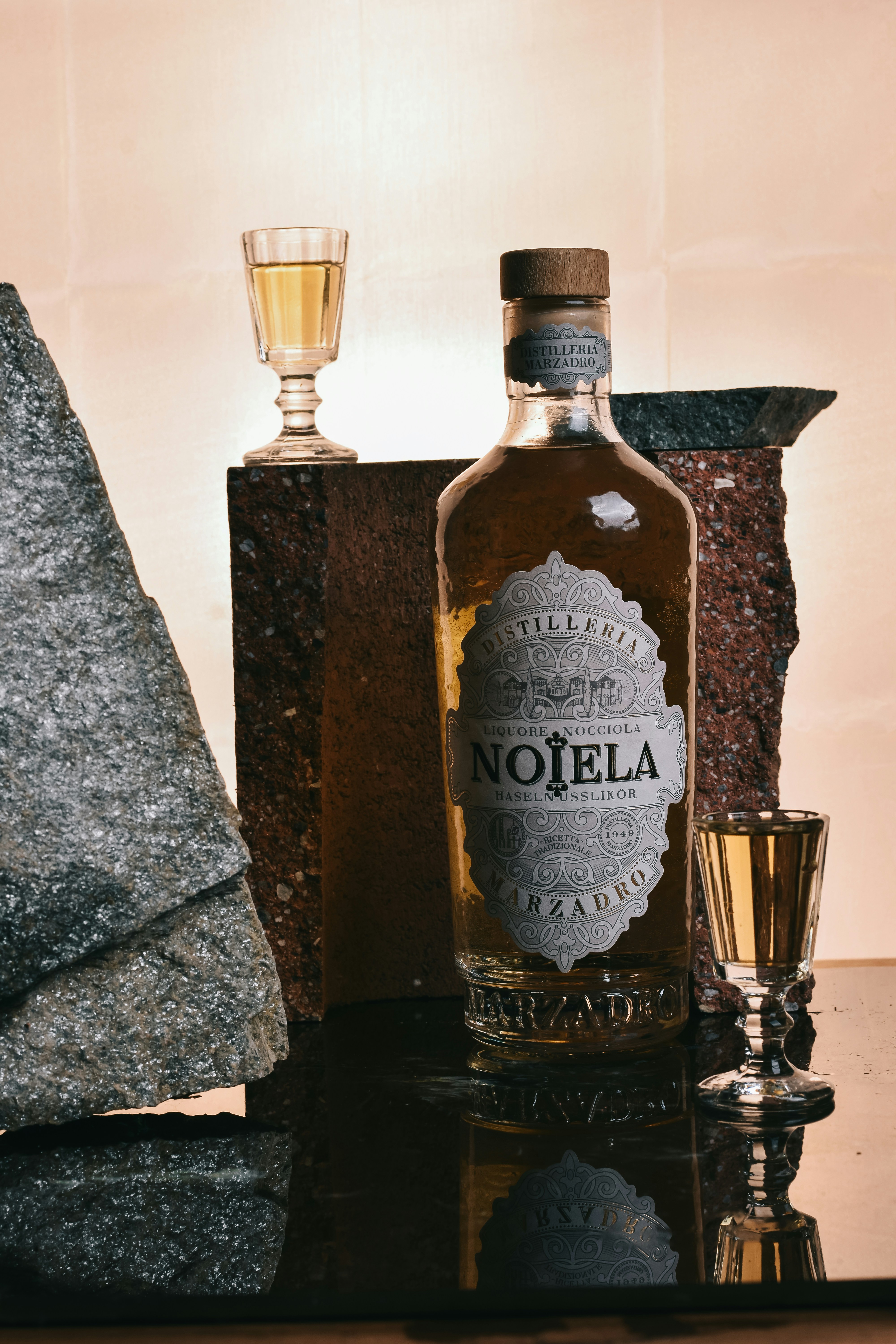 Bottle of noiela mezcal with two shot glasses