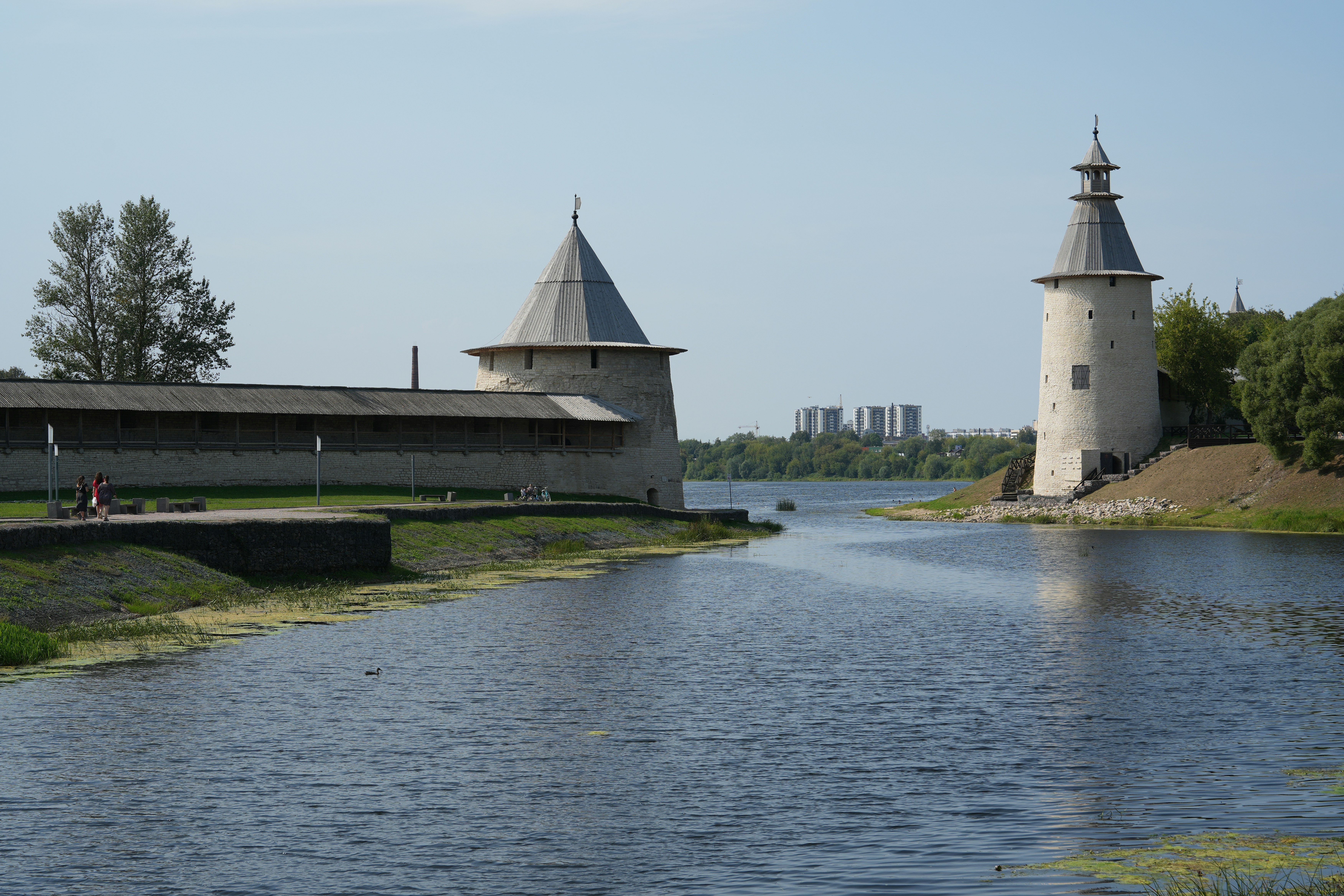 Stone fortress walls and towers on a riverbank
