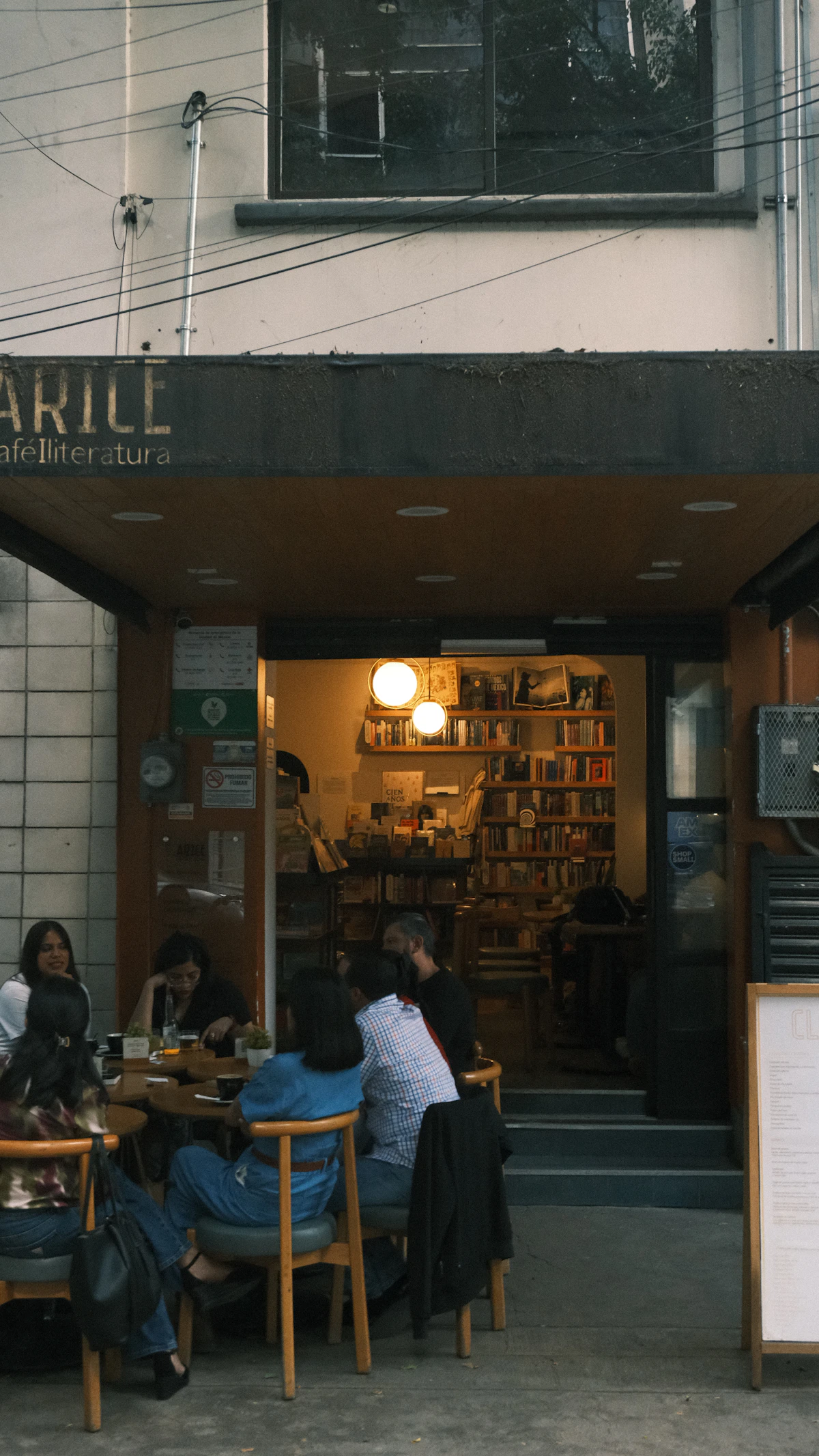 People sitting outside a bookstore cafe in Mexico City