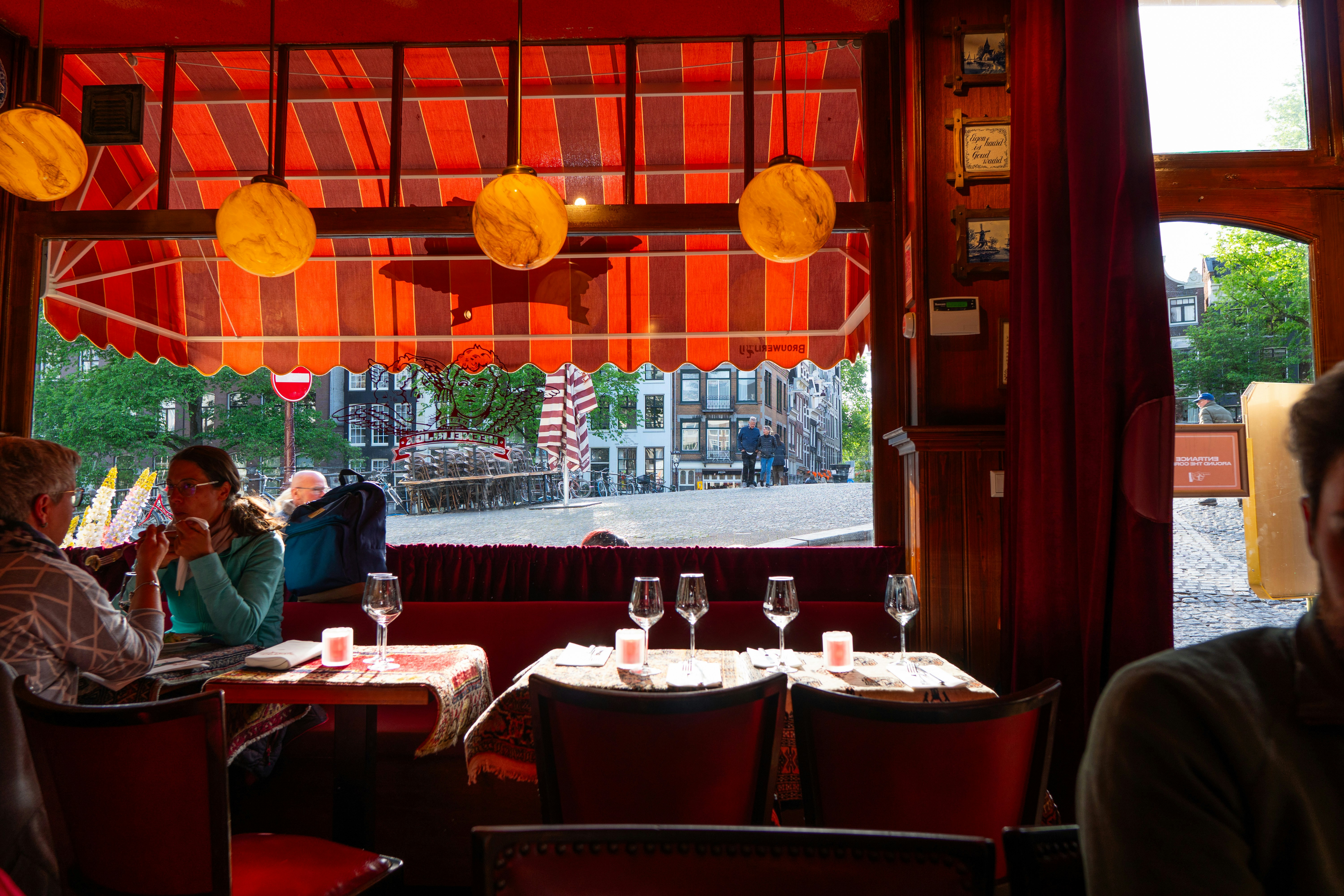 Cozy cafe interior with tables and people