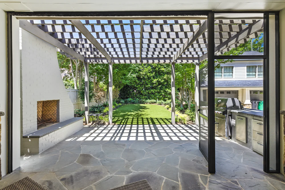 Wooden pergola shading a terrace seating area
