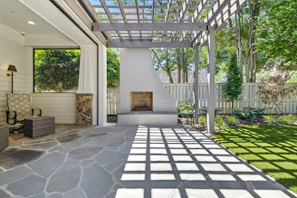 Outdoor patio with fireplace and pergola