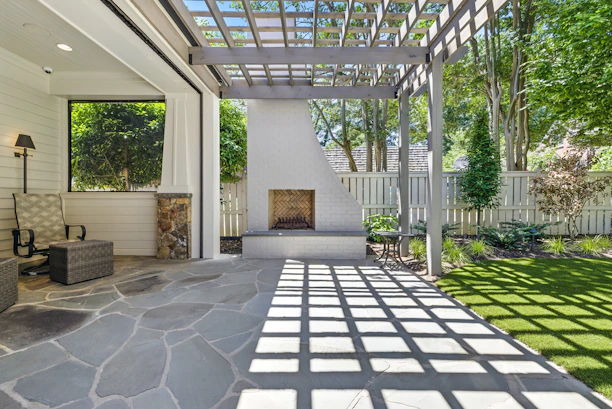 Outdoor patio with fireplace and pergola