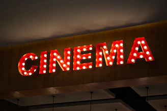 Retro cinema sign with illuminated bulbs