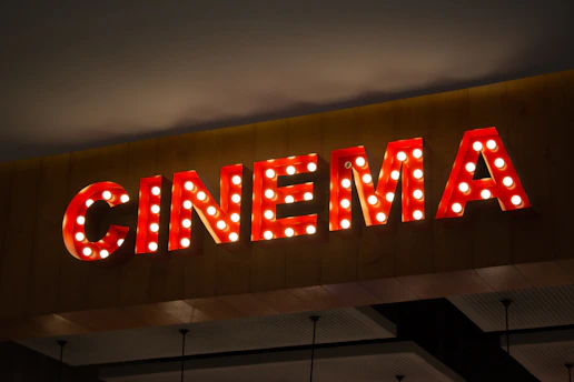 Retro cinema sign with illuminated bulbs