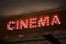 Retro cinema sign with illuminated bulbs
