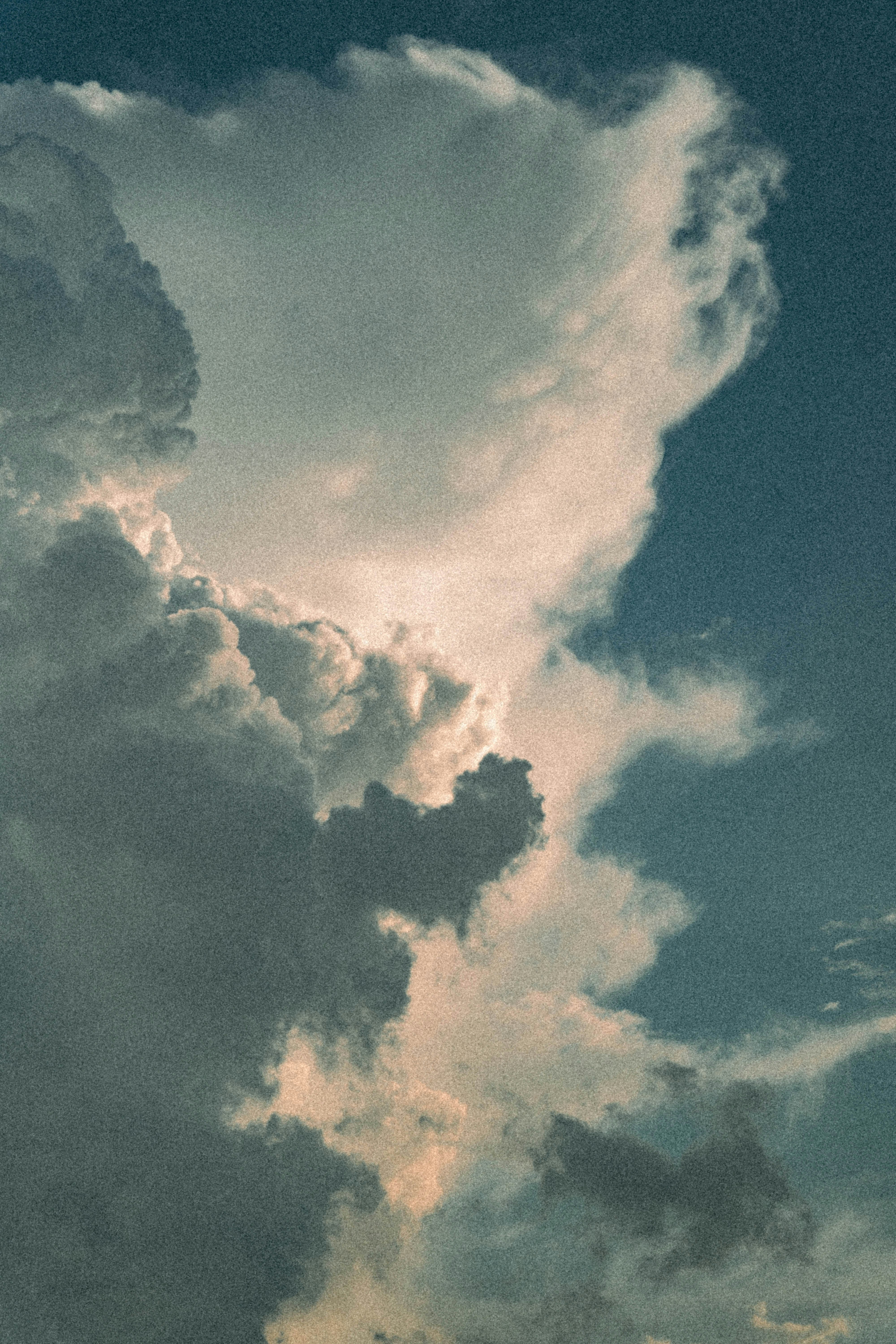 Dramatic clouds against a bright blue sky