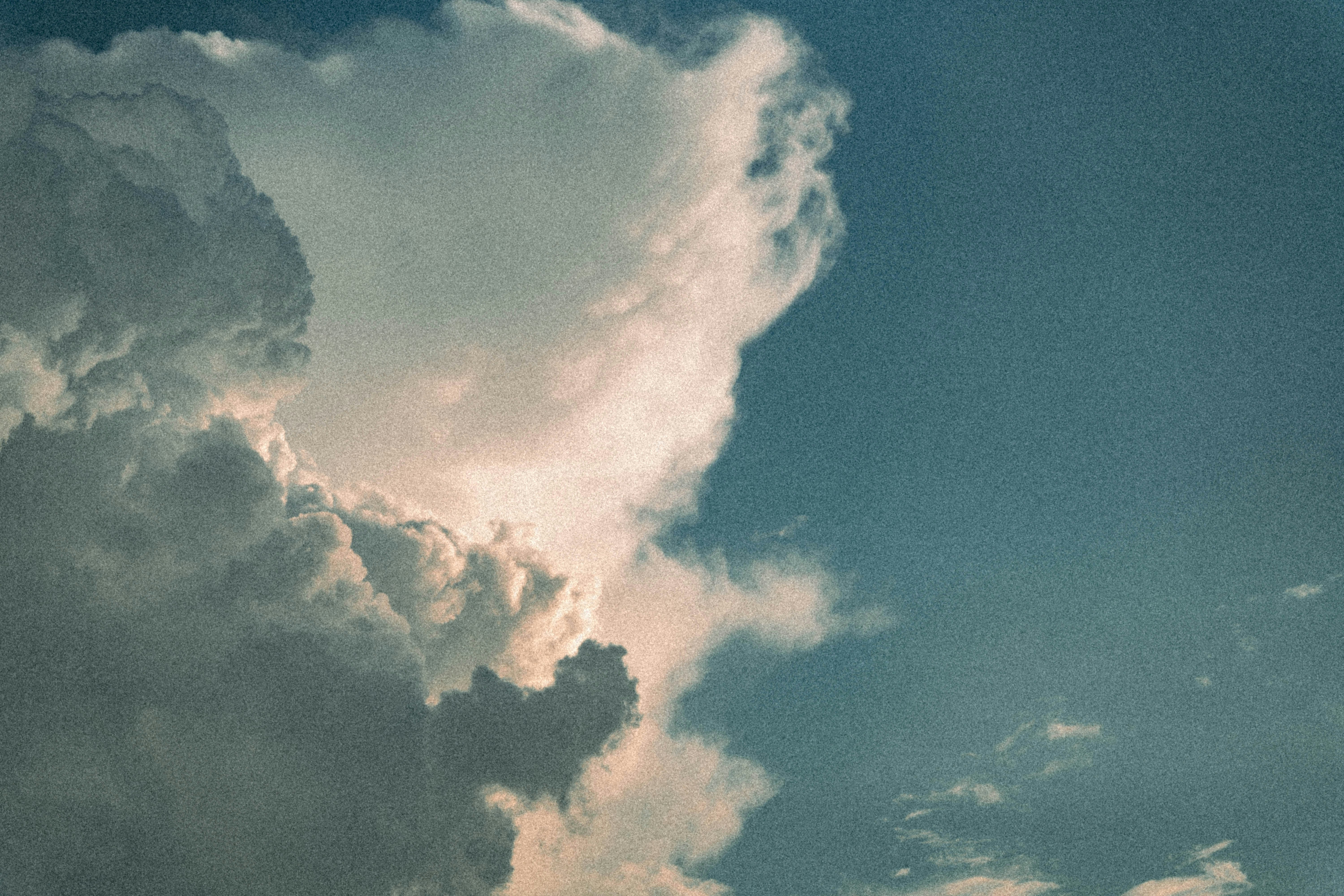 Large white clouds against a blue sky