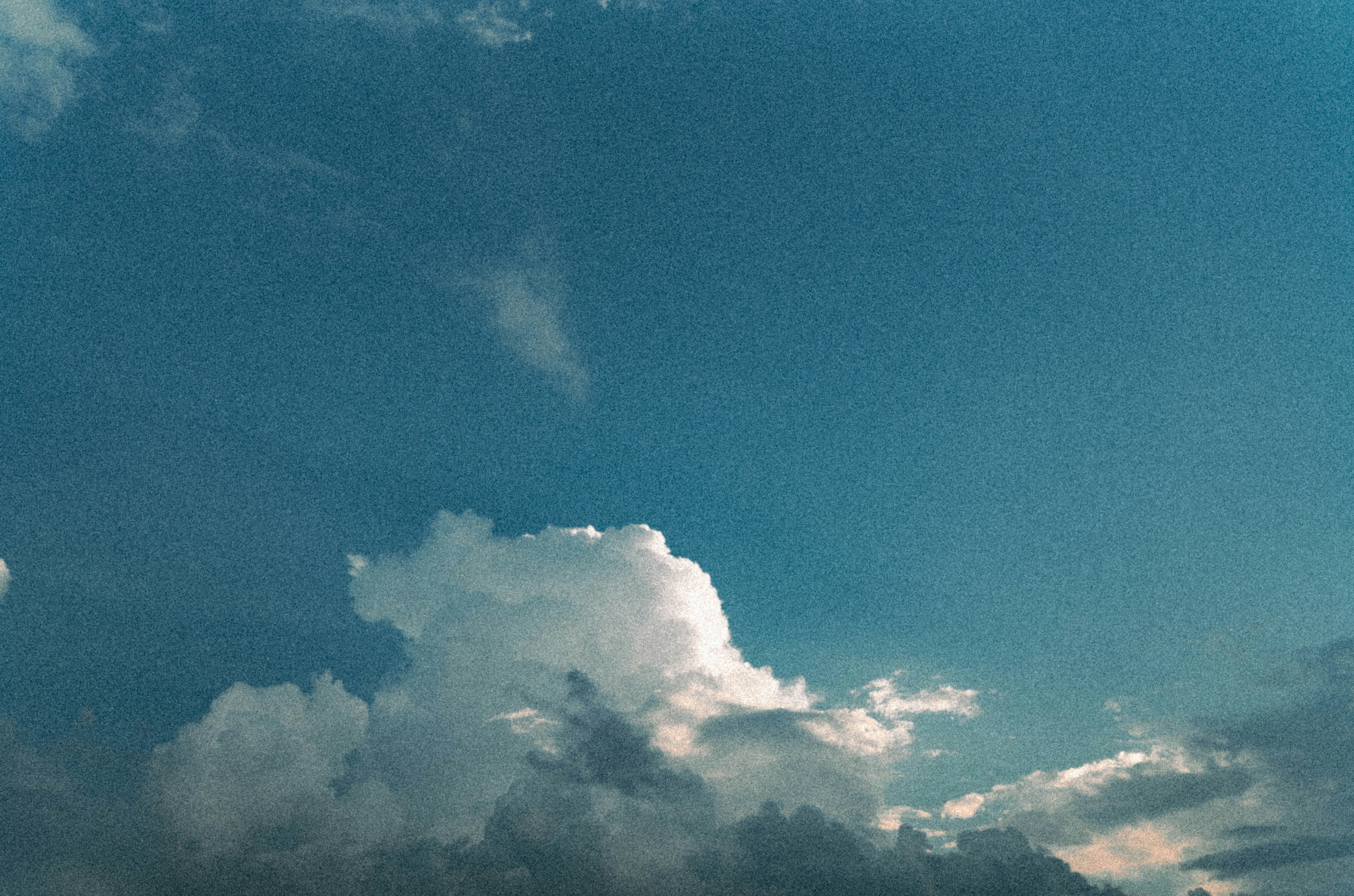 Dramatic clouds against a deep blue sky