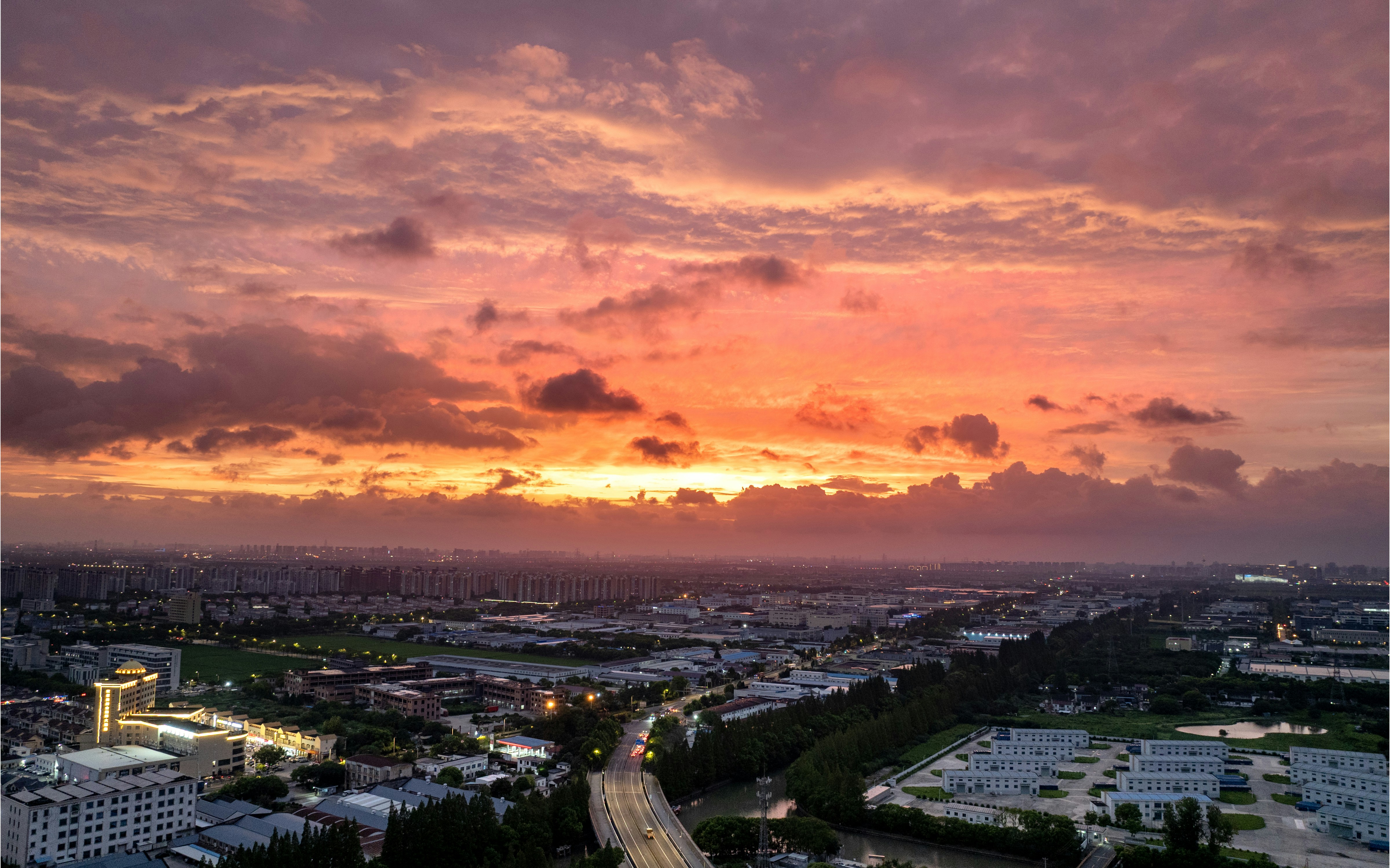 Vibrant sunset over a sprawling cityscape