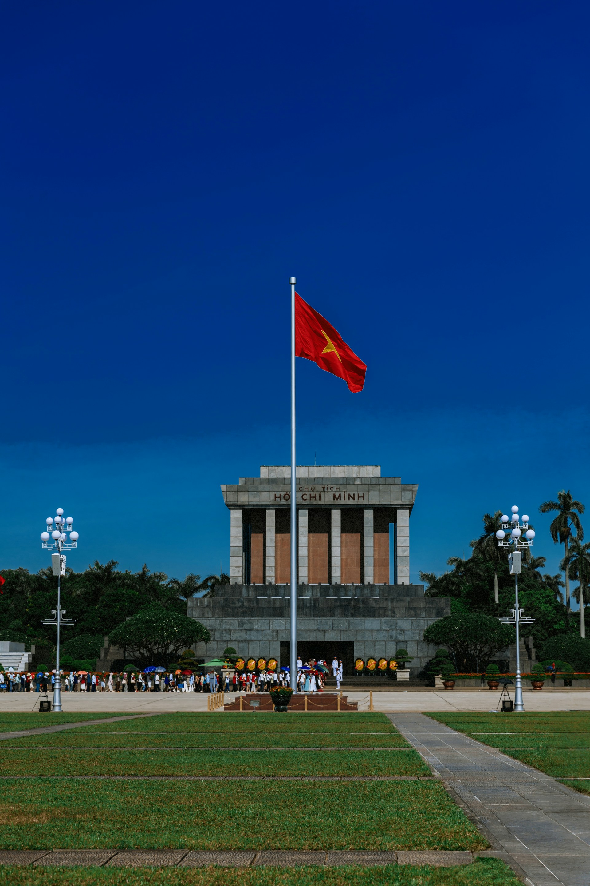 Vietnam flag flies in front of ho chi minh mausoleum