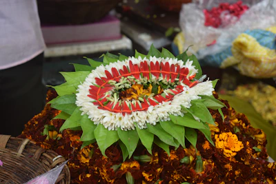 A decorative arrangement of flowers and leaves