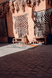 Zebra hides displayed outside a building