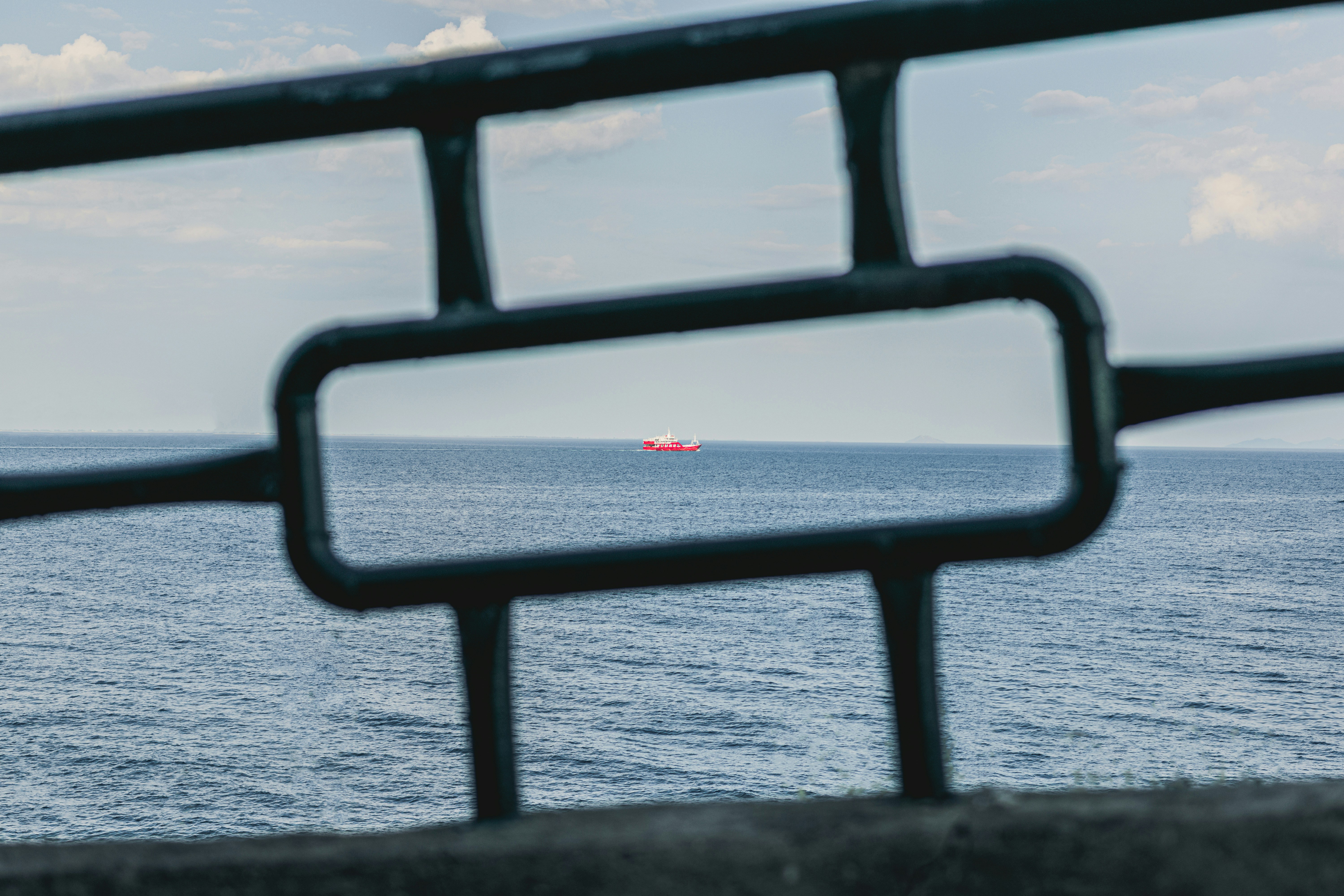 Sunset over the ocean seen through a frame.