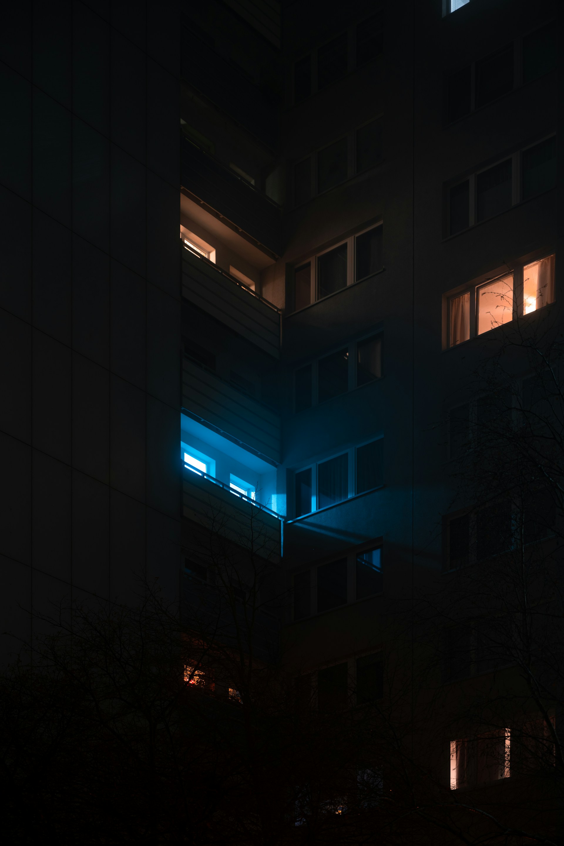 Apartment building windows glowing at night