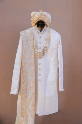 Traditional indian groom's attire with sherwani and turban