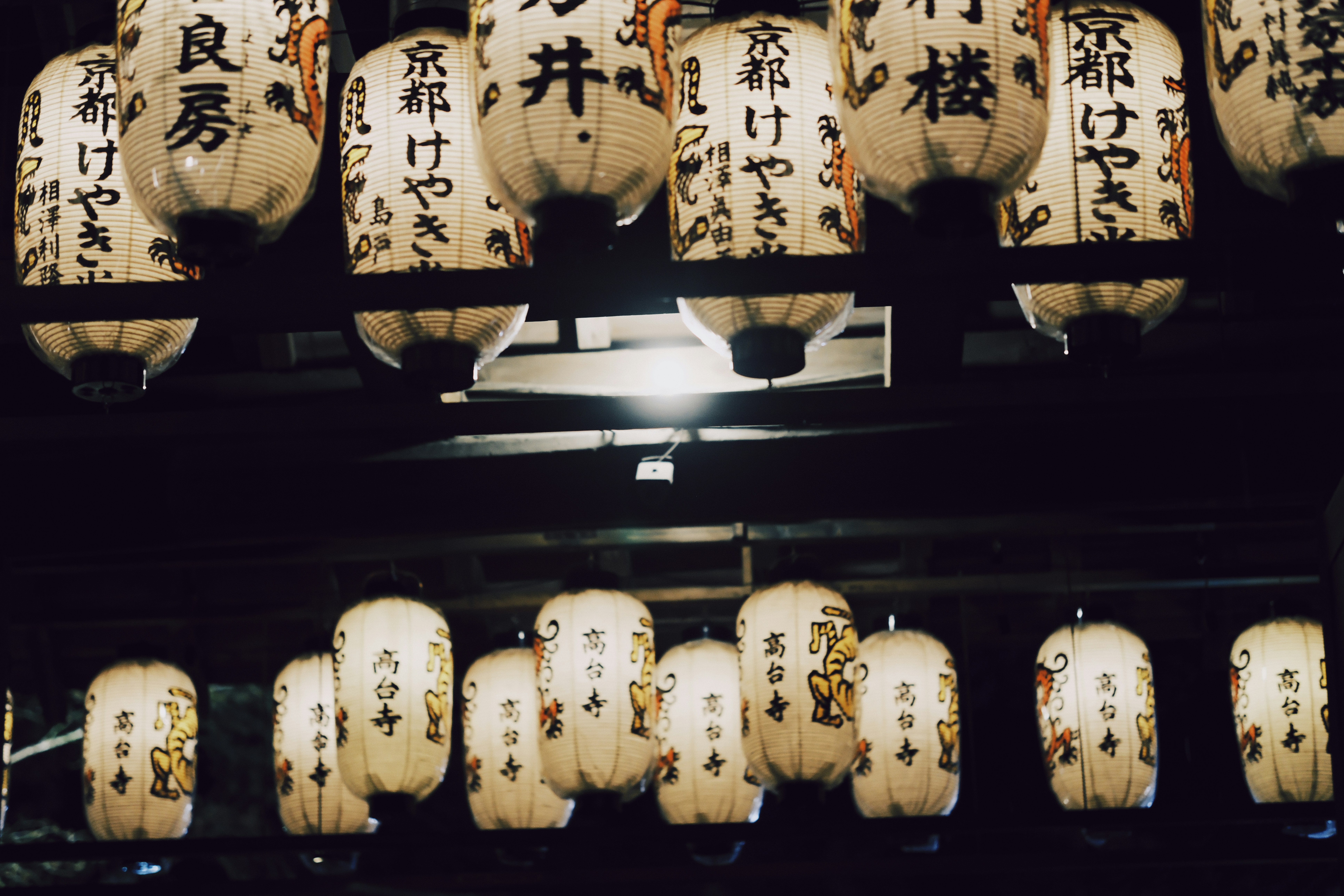 Selection of Japanese onigiri (rice balls) in a convenience store display, some with warming instructions visible