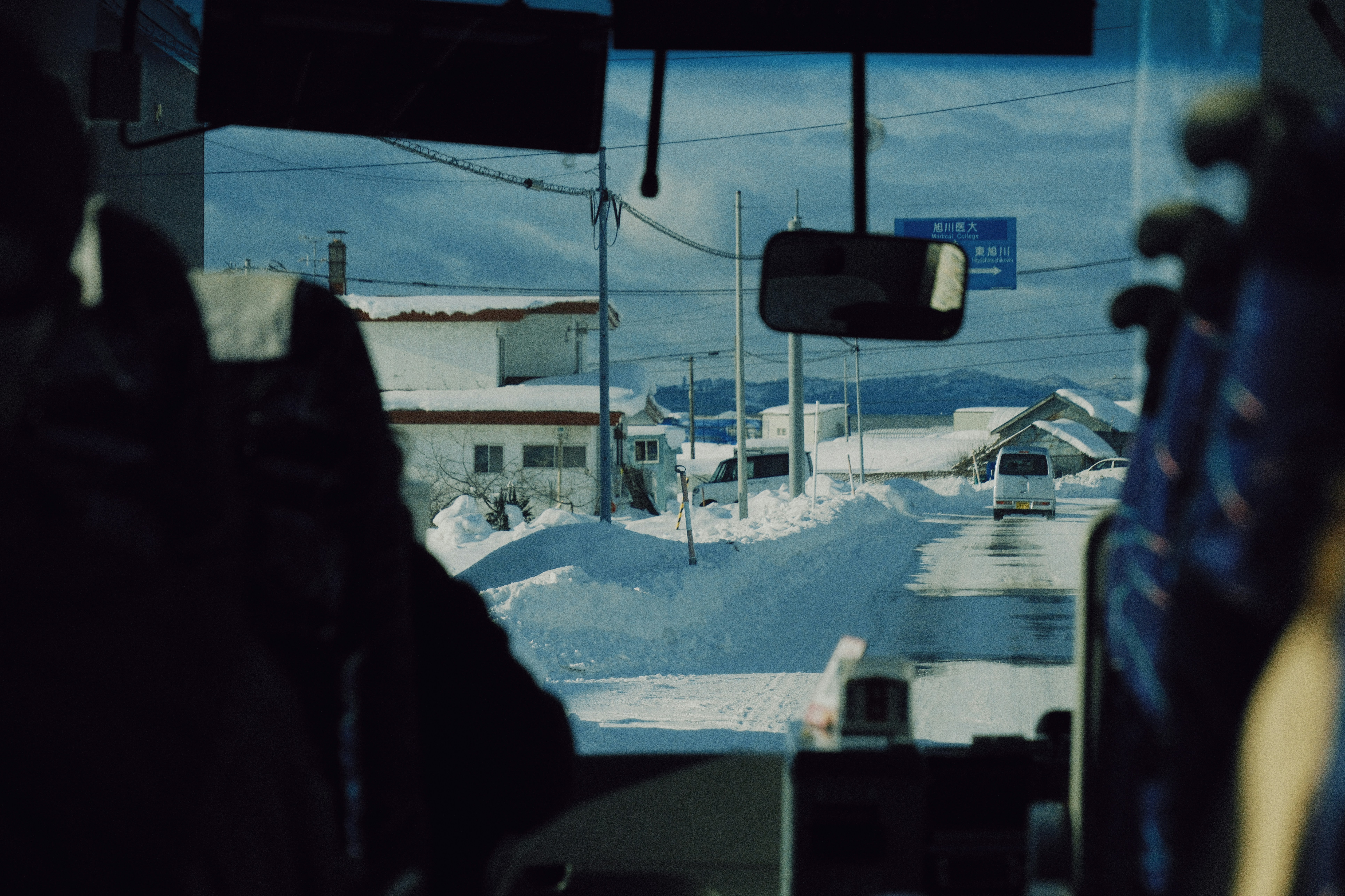 Snowy landscape seen from a bus window in Hokkaido