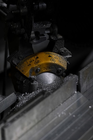 Close-up of industrial machinery with metal shavings.