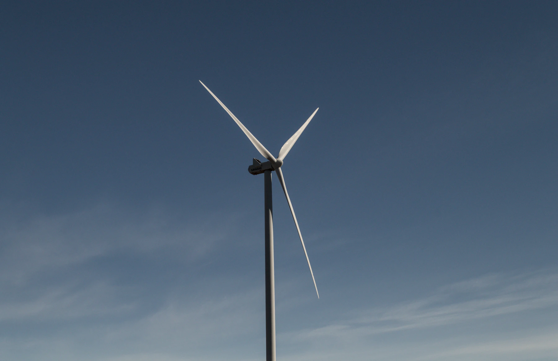 Wind turbine against a clear blue sky
